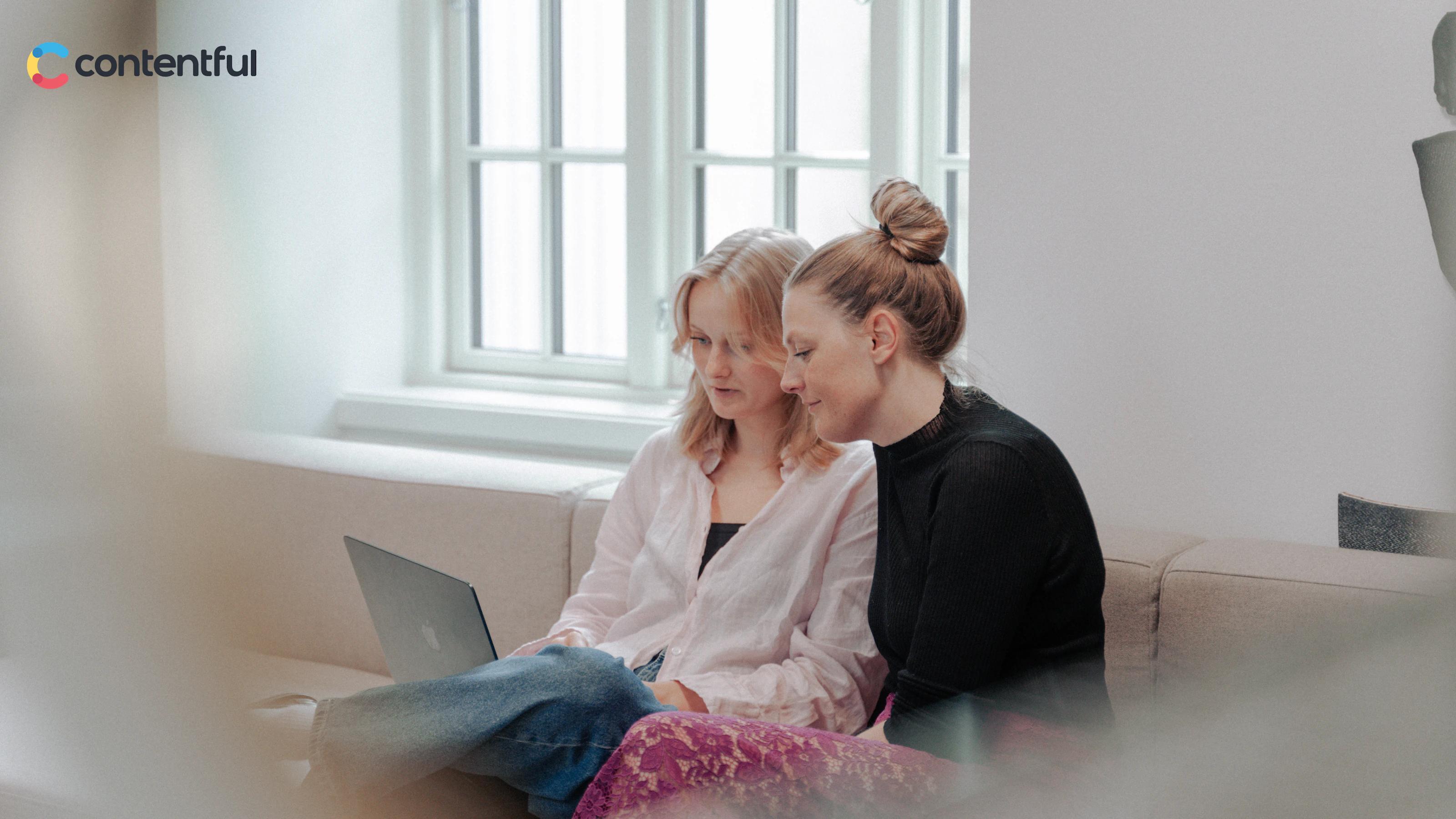 Two women working and the Contentful logo