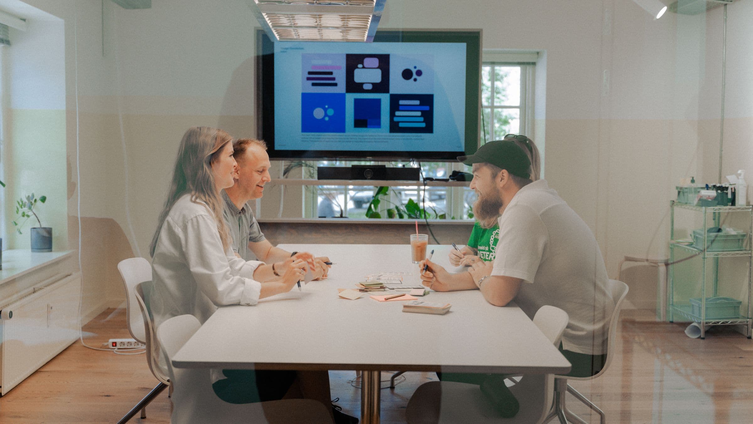 Adapt Web Development Team in a Meeting Room Behind Glass